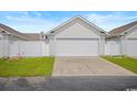 A spacious two-car garage with an expansive driveway offers plenty of parking space at 908 Wrigley Dr. # 17-3_17-3G, Myrtle Beach, SC 29588