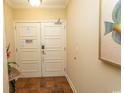 Condo entryway with tile flooring, a decorative table and artwork that adds to the coastal atmosphere at 100 North Beach Blvd. # 1511, North Myrtle Beach, SC 29582