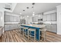 Spacious kitchen featuring gray cabinets, stainless appliances, granite countertops and a large center island with seating at 1008 Mary Read Dr., North Myrtle Beach, SC 29582