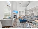 Bright living room with vaulted ceilings, a cozy fireplace, comfortable seating, and an open floor plan at 1008 Mary Read Dr., North Myrtle Beach, SC 29582