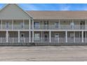 The image shows the exterior of the condo building during daylight hours at 117 Butkus Dr. # 6, Myrtle Beach, SC 29588