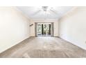 Spacious living room with large sliding glass doors leading to outdoor deck at 159-1 Weehawka Way # 159-1, Pawleys Island, SC 29585