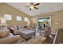 Cozy living room with comfortable furniture, neutral color palette, and a sliding door with water views at 1631 Hepburn Dr., Little River, SC 29566