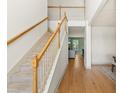 Bright foyer with hardwood floors and a staircase leading to the second floor at 18 Cyclamen Ct., Murrells Inlet, SC 29576
