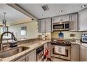 Updated kitchen features stainless steel appliances, granite countertops, and plenty of storage space at 1990 N Waccamaw Dr. # 1008, Murrells Inlet, SC 29576