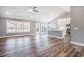 Bright, open living space with hardwood floors, a vaulted ceiling, and access to kitchen and outdoor areas at 2004 Potomac Ct., Myrtle Beach, SC 29579