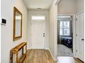 Entryway featuring wood flooring, a console table, and a view into the bedroom at 2315 Blackthorn Dr., Conway, SC 29526