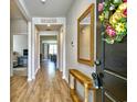 Welcoming entryway with a wooden console table and a view into the open-concept living spaces at 2315 Blackthorn Dr., Conway, SC 29526