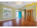 Spacious living room boasts hardwood floors, large windows, and a vibrant blue door at 264 La Patos Dr., Myrtle Beach, SC 29588