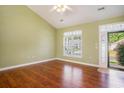 Bright living room offers hardwood floors and ample natural light from the large window at 264 La Patos Dr., Myrtle Beach, SC 29588