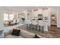 Open concept kitchen with granite countertops, stainless steel appliances, and bar seating at 2700 Tranquility Loop, Longs, SC 29568