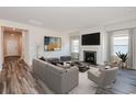 Cozy living room with fireplace, gray sofa, and neutral decor at 2700 Tranquility Loop, Longs, SC 29568