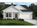 Beautiful single-Gathering home with gray siding, white trim, and manicured lawn at 2708 Tranquility Loop, Longs, SC 29568