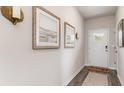 Inviting entryway with stylish wall decor and hardwood flooring at 3599 Ashridge Way, Conway, SC 29526