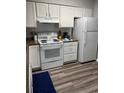 Functional kitchen with white appliances and ample countertop space at 4107 Pinehurst Circle # Dd-15, Little River, SC 29566