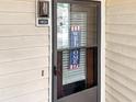 Close-up of front door with welcome sign at 4477 Little River Inn Ln. # 1802, Little River, SC 29566