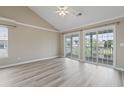 Spacious bedroom featuring high ceilings, light wood flooring, and sliding doors at 4924 Pond Shoals Ct. # 201, Myrtle Beach, SC 29579