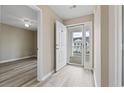 Bright foyer with light wood floors, an open door, and neutral paint at 4924 Pond Shoals Ct. # 201, Myrtle Beach, SC 29579
