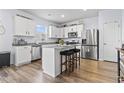 Modern kitchen with stainless steel appliances, granite countertops, and a center island at 5001 Sweet Birch Lane, Conway, SC 29526