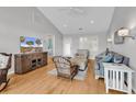 Cozy living room with hardwood floors, comfortable seating, a ceiling fan and a television at 521 Bay Drive Ext., Garden City Beach, SC 29576