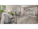 Comfortable living room with neutral tones, plush sofa, and modern decor, flowing into a bright kitchen at 576 Strawberry Field Way, Galivants Ferry, SC 29544
