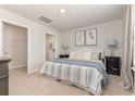 Serene bedroom featuring a queen-sized bed, walk-in closet, and an en-suite bathroom at 576 Strawberry Field Way, Galivants Ferry, SC 29544