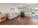 Inviting living room with hard wood flooring and neutral colored furnishings and ample natural light at 613 S 2Nd Ave. # 21D, North Myrtle Beach, SC 29582