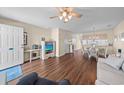 Open-concept living space features wood floors, neutral tones, and natural light at 613 S 2Nd Ave. # 21D, North Myrtle Beach, SC 29582