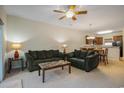Living room with plush couches, ceiling fan, lamps, and dining table in an open concept at 6253 Catalina Dr. # 1523, North Myrtle Beach, SC 29582
