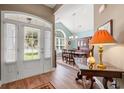 Inviting home foyer featuring hardwood floors and a view into the dining room at 1025 Limpkin Dr., Conway, SC 29526