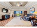 Spacious living room with coffered ceilings and sliding doors to the backyard at 1025 Limpkin Dr., Conway, SC 29526