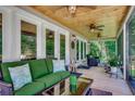 Inviting screened porch with comfortable seating, ceiling fans, and a beautiful wood ceiling at 112 Blue Gull Dr., Conway, SC 29526