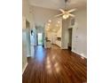 Open-concept living space with hardwood floors seamlessly connecting the living room to the kitchen at 118 Retreat Pl., Little River, SC 29566