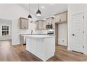 Modern kitchen featuring a kitchen island, stainless steel appliances, and eat in dining area at 146 Temple Dr., Aynor, SC 29511
