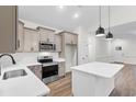 Modern kitchen with stainless steel appliances, quartz counters, and a large kitchen island at 146 Temple Dr., Aynor, SC 29511