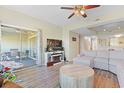Open-concept living area featuring a sliding glass door to the balcony, hardwood floors, and stylish decor at 1551 Spinnaker Dr. # 5913, North Myrtle Beach, SC 29582