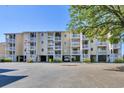 Coastal condo featuring multiple balconies, ample parking, and convenient ground-level covered parking at 1912 Goose Creek Rd. Sw # 4302, Ocean Isle Beach, NC 28469
