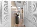 Hallway with modern light fixtures, and closet doors, suggesting organized storage throughout the living space at 210 Double Eagle Dr. # B-2, Surfside Beach, SC 29575