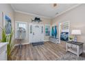 Inviting foyer with wood floors, marlin decor, and views into the adjacent bedroom at 2405 Duffy St., North Myrtle Beach, SC 29582