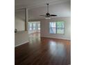 Spacious living room with a ceiling fan and large window, filled with natural light at 281 Palmetto Glen Dr., Myrtle Beach, SC 29588
