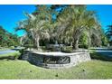 Community sign with an artistic stone-stacked base and a beautiful water feature at 3105 Robyn Ct., Little River, SC 29566