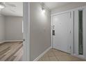 Entryway featuring tile flooring, neutral paint and a closed white door at 415 Ocean Creek Dr. # 2388, Myrtle Beach, SC 29572