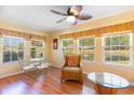 Bright living area featuring large windows and warm wicker furniture accents at 4280 Santolina Way # C, Murrells Inlet, SC 29576