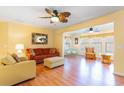 Cozy living room with wood floors and ceiling fans, perfect for relaxing and entertaining at 4280 Santolina Way # C, Murrells Inlet, SC 29576
