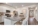 Modern kitchen with stainless steel appliances, granite countertops, and ample cabinet space at 506 Sagebrush St., Myrtle Beach, SC 29588