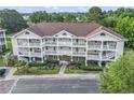 Lovely exterior view of a multi-story condo building, enhanced by well-maintained lawns and attractive landscaping at 5750 Oyster Catcher Dr. # 822, North Myrtle Beach, SC 29582