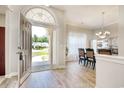 View of foyer featuring an arched transom and open floor plan that leads into a dining area at 6705 Oakmere Ct., Murrells Inlet, SC 29576