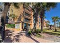 Beautiful exterior of the resort featuring palm trees and inviting lounge areas at 6900 N Ocean Blvd. # 1041, Myrtle Beach, SC 29577