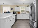 Bright open kitchen with white cabinets, stainless appliances and tiled floors at 701 Salleyport Dr. # 1110, Myrtle Beach, SC 29579