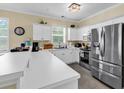 Bright kitchen featuring stainless steel appliances, white cabinets, and a breakfast bar at 701 Salleyport Dr. # 1110, Myrtle Beach, SC 29579